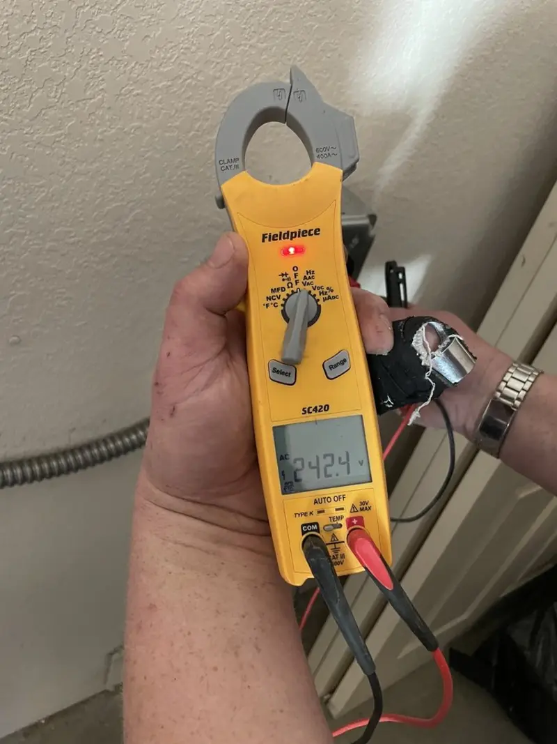 Voltage testing with clamp meter during Electrical Installation Services in Clovis